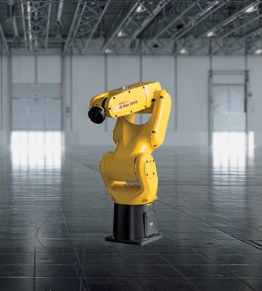 Robot LR Mate 200iD de FANUC que realiza la carga y descarga automática de piezas