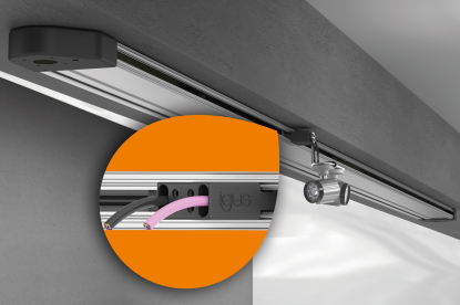 Sistema de perfil bajo para movimientos de cable sin cadena portacables